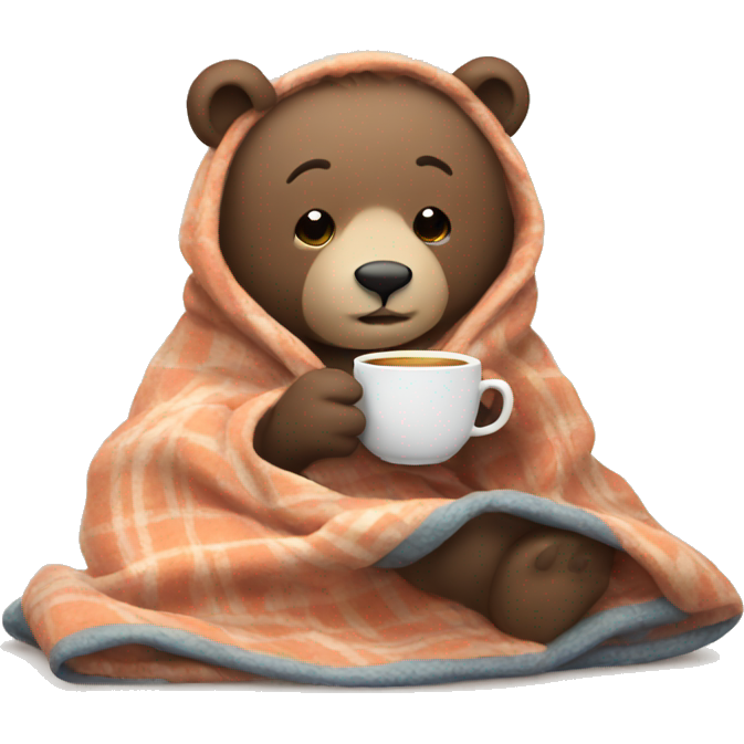 Cozy bear in a blanket drinking tea